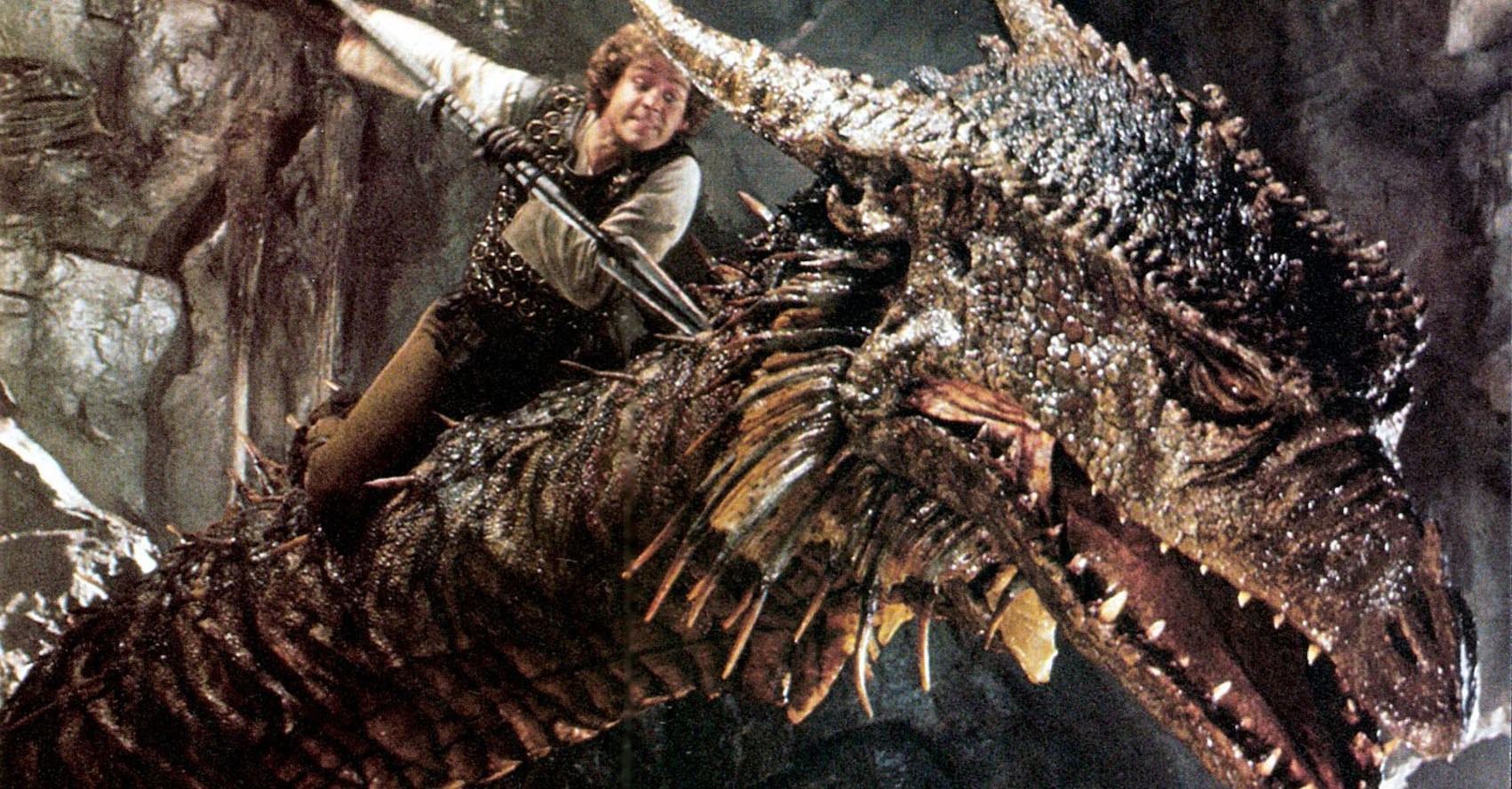 um homem esfaqueando um dragão no pescoço com uma lança