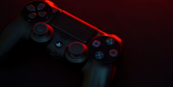 red and black sony ps 4 game controller