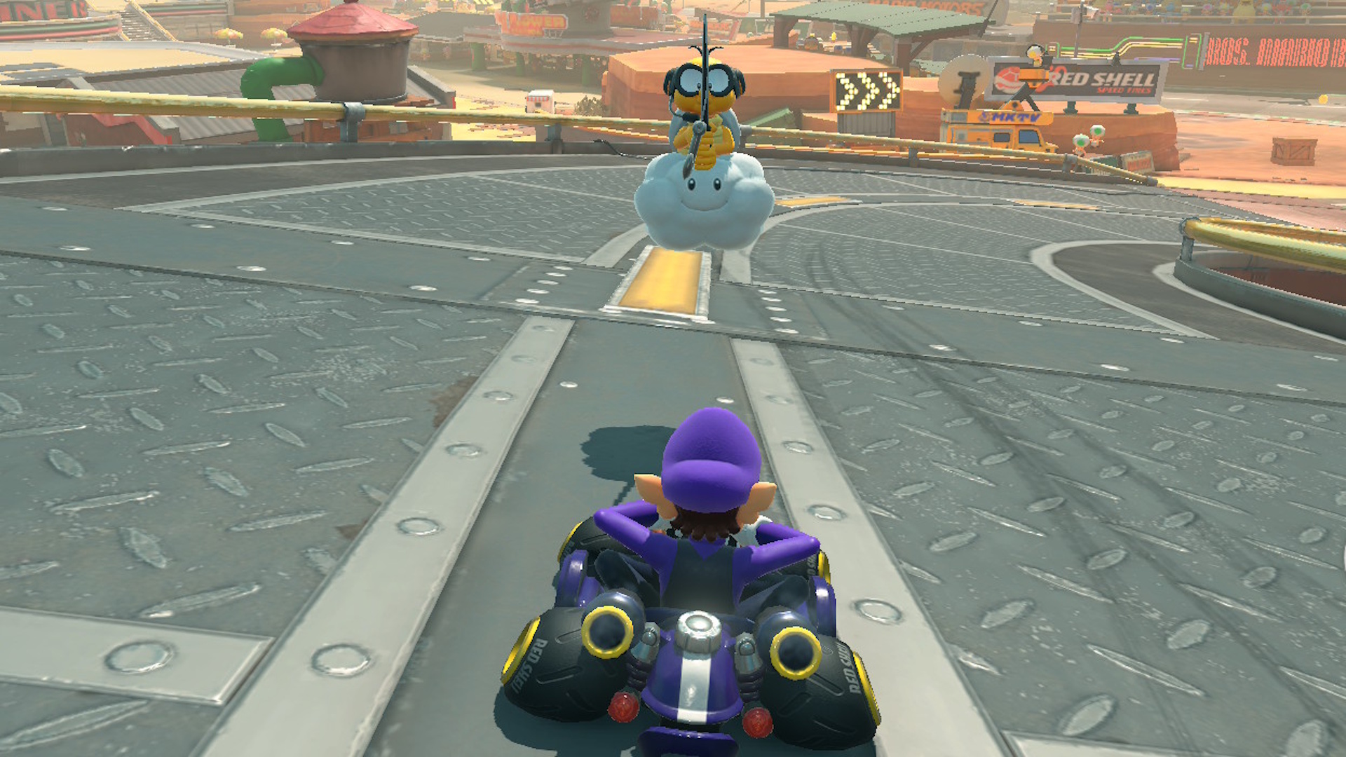 Lakitu substituindo Waluigi em um curso após um acidente em Mario Kart World