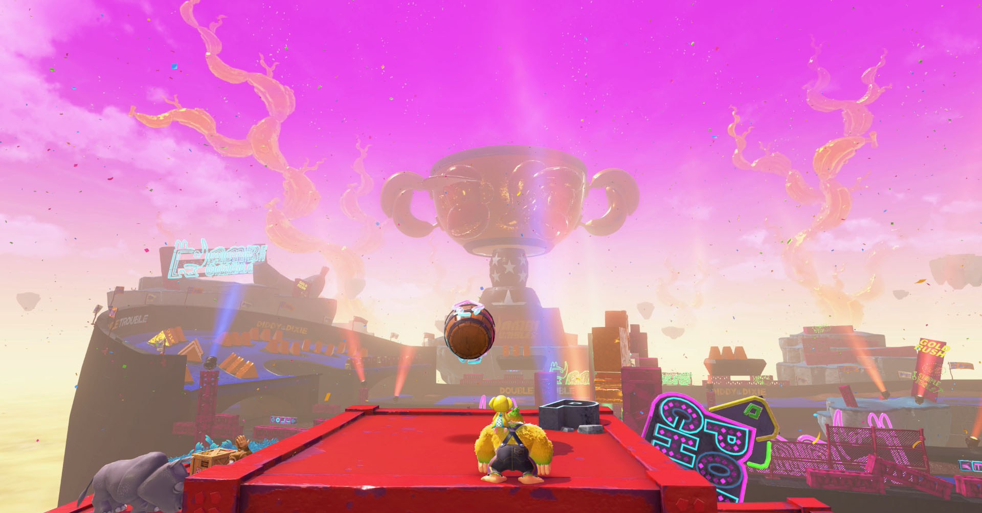 Uma captura de tela de Bananza de Donkey Kong mostrando DK e Pauline olhando para o troféu gigante na camada de corrida. Uma captura de tela de Bananza de Donkey Kong mostrando DK e Pauline olhando para o troféu gigante na camada de corrida.