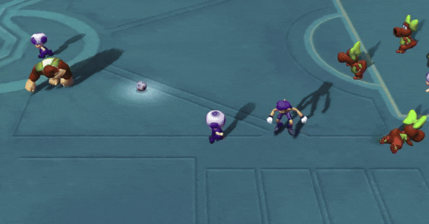 Toad Rams Donkey Kong no chão em Super Mario Strikers Toad Rams Donkey Kong no chão em Super Mario Strikers