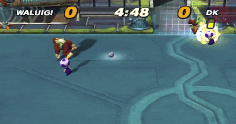 Toad Rams Donkey Kong em um campo eletrificado em Super Mario Strikers Toad Rams Donkey Kong em um campo eletrificado em Super Mario Strikers