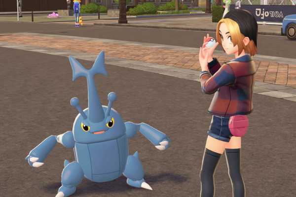 Um treinador Pokémon posa com seu Heracross em Pokémon Legends: ZA