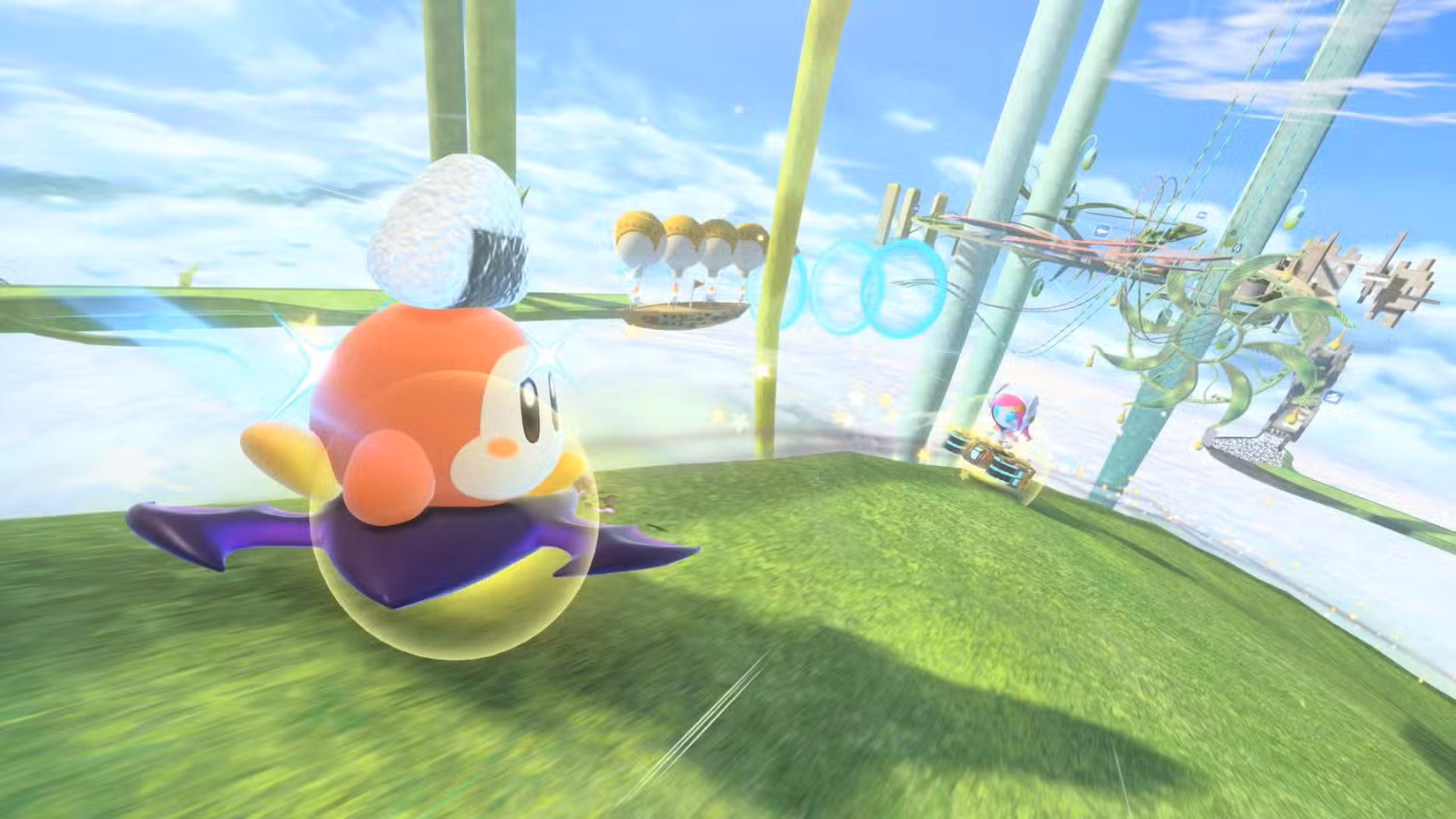 Um Waddle Dee com um bolinho de arroz na cabeça passa por uma garota robô em Kirby Air Riders.