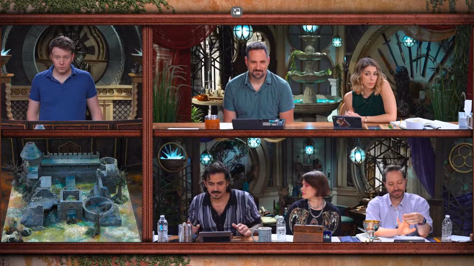Uma imagem do episódio 8 da campanha Critical Role 4. Apresenta Brennan Lee Mulligan, Travis Willingham, Laura Bailey, Robbie Daymond, Whitney Moore e Sam Riegel enquanto examinam um mapa de batalha.