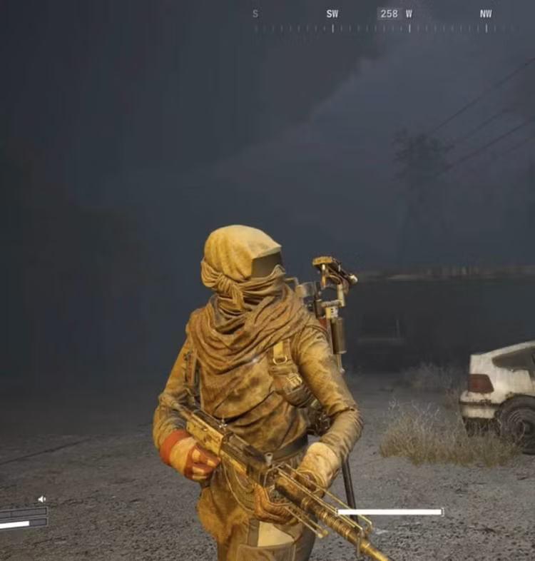 A roupa que o jogador usa durante o tutorial do Arc Raiders: um lenço envolvente, óculos de areia e uma túnica, toda marrom-amarelada.