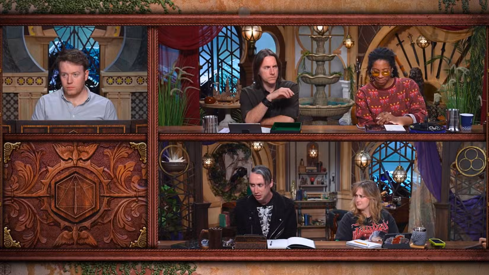 Uma imagem da Critical Role Campaign 4, episódio 12. Apresenta Brennan Lee Mulligan, Matthew Mercer, Aabria Iyengar, Alexander Ward e Ashley Johnson em um cenário de fantasia.