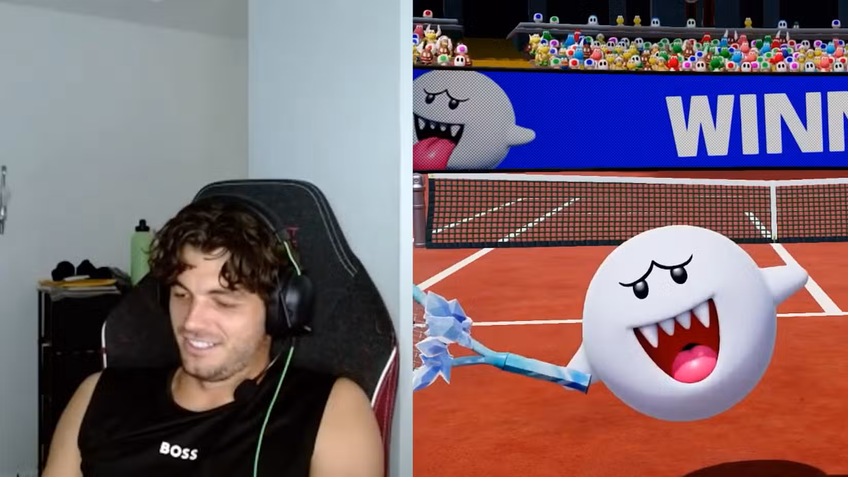 Taylor Fitz sorri para seu Nintendo Switch. O personagem fantasma Boo faz uma pose de vitória.