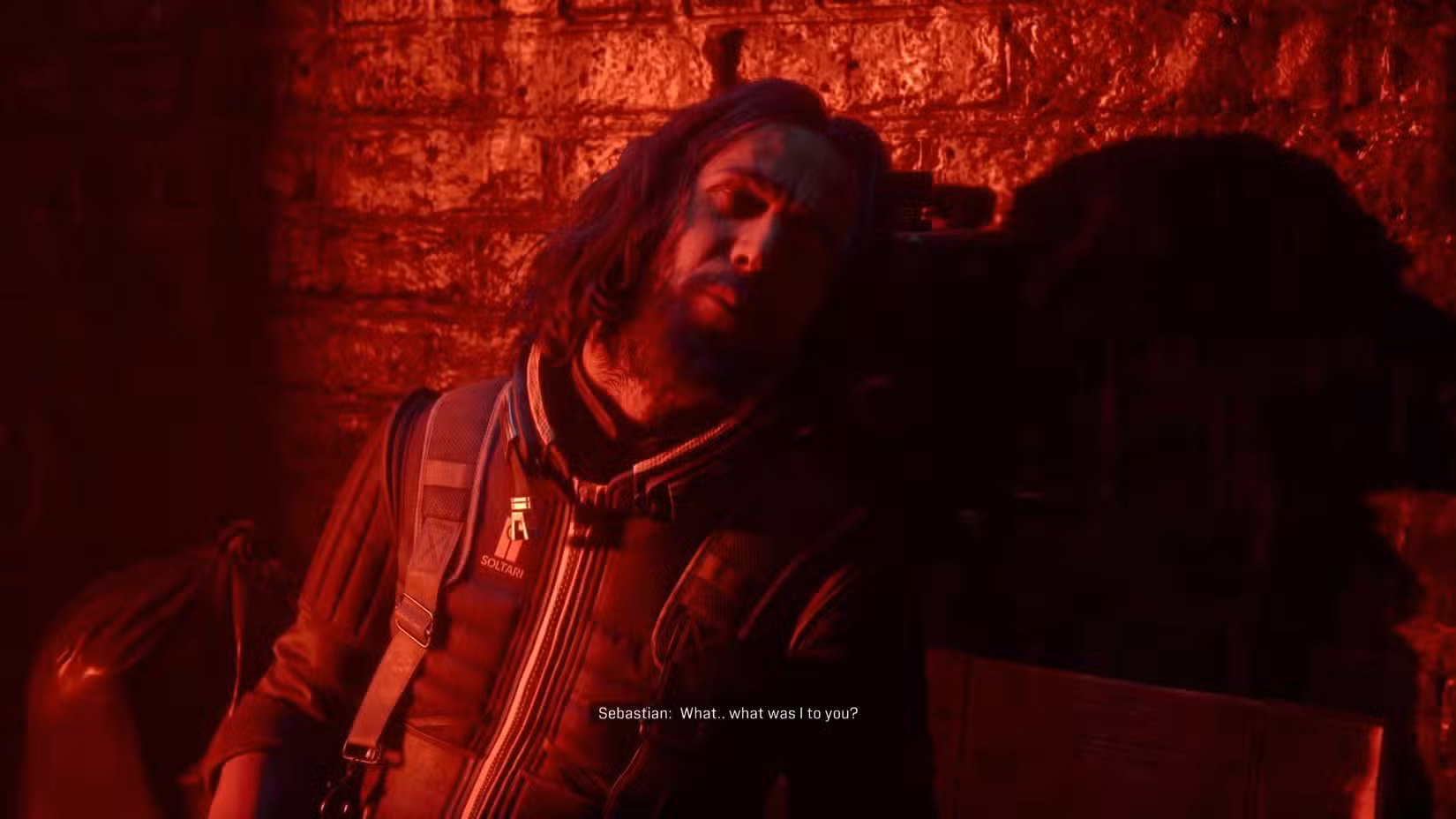 Sebastian morrendo em Saros enquanto pergunta a Arjun o que ele era para ele.